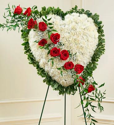 A White Sympathy Heart With Red Trailing Roses