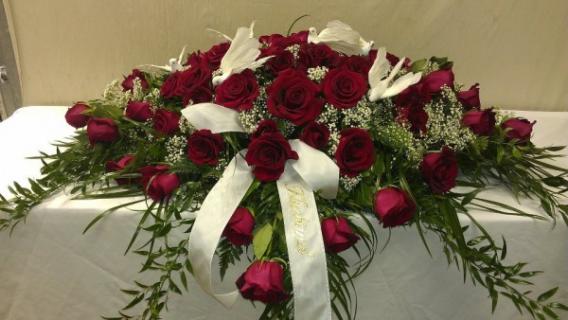 DOVE CASKET SPRAY WITH RED ROSES